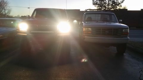 1996 Ford F-250 - Bad size comparo of a co-workers F250 on the right. I believe his is a 97, 4x4, 351 auto, stock suspension, 235/85s.