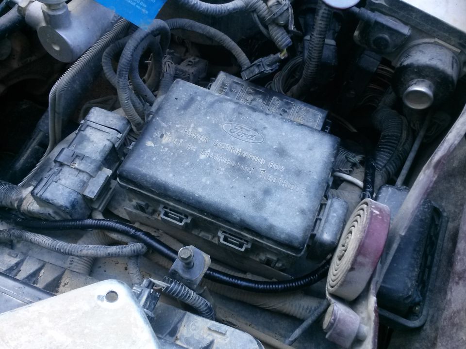 1996 Ford Bronco engine bay, showing the power distribution box and wiring.