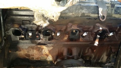 1996 Ford F-250 - The hard part. I fully expected to not even get to 50% completion today. Both bolts in cylinder 4 (far left port in picture) were broken by…