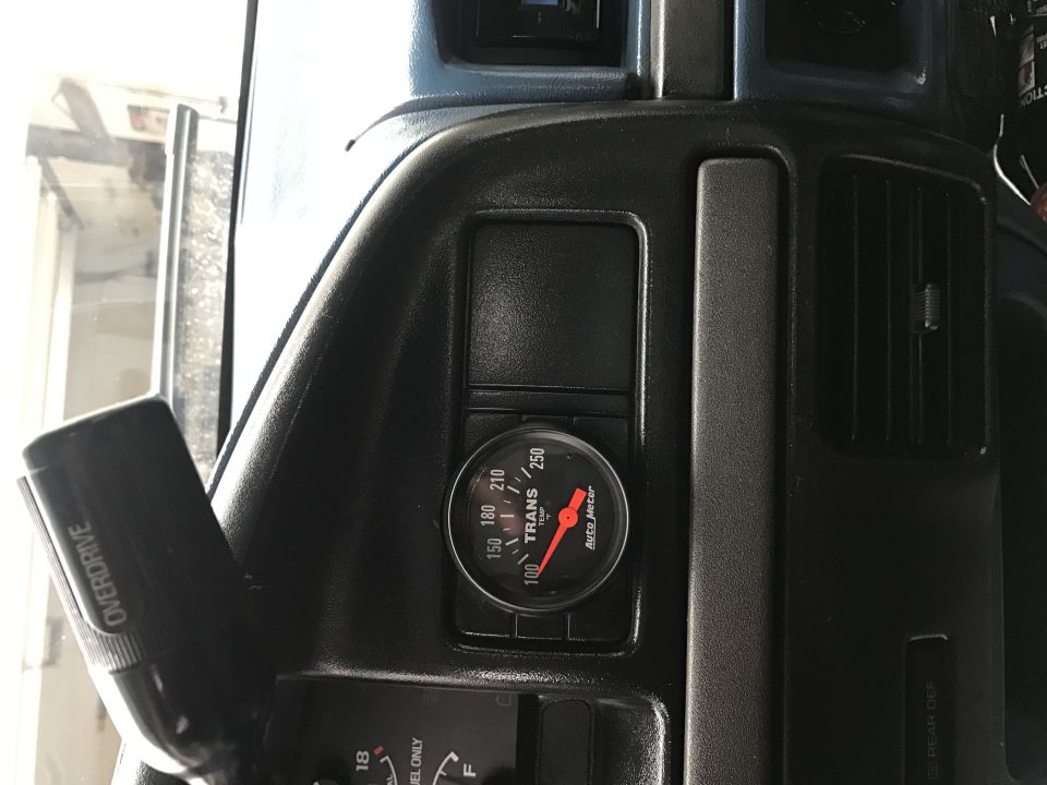 Dashboard with transmission temperature gauge and overdrive lever.