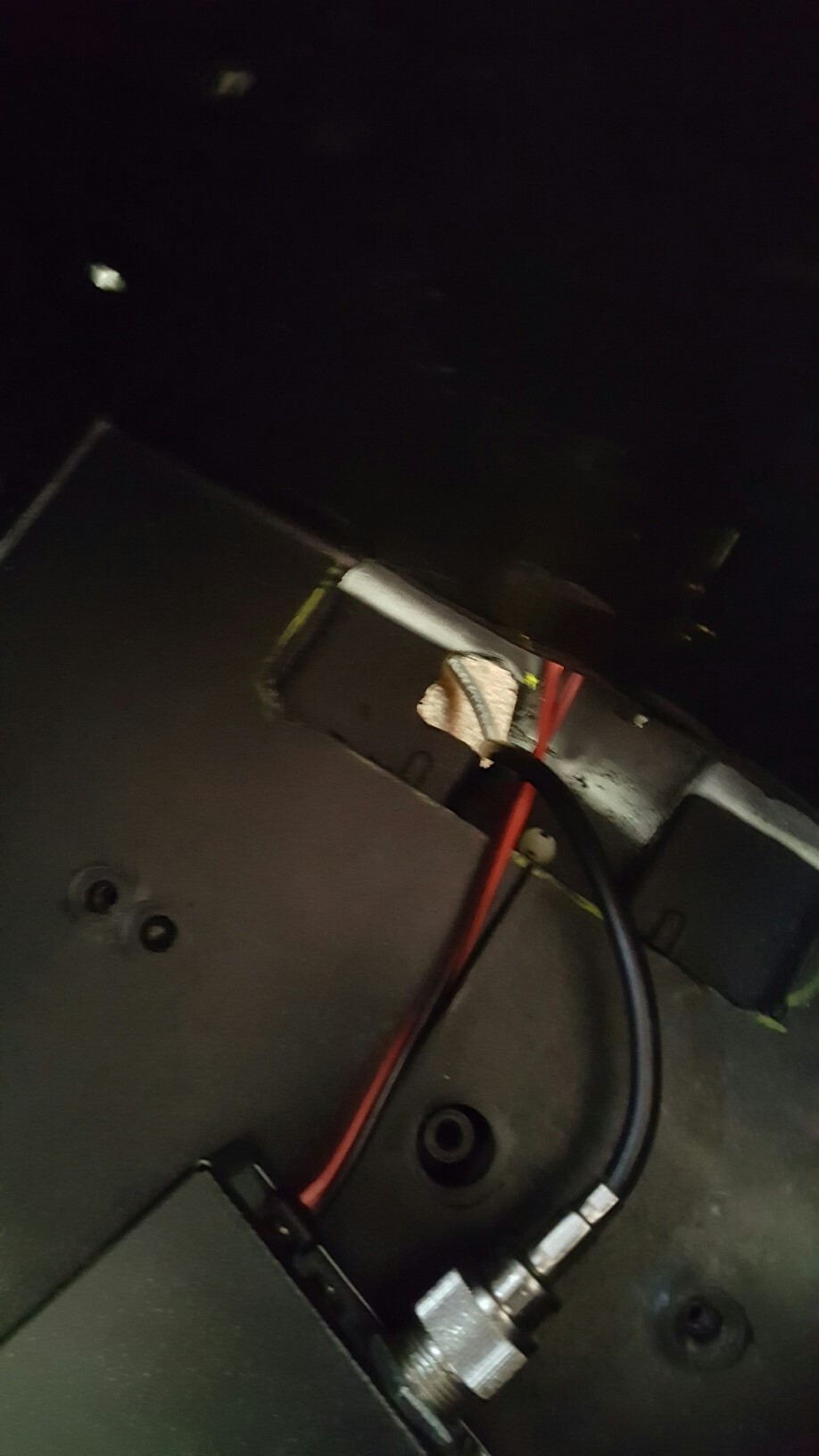 Wires and connector on a black panel