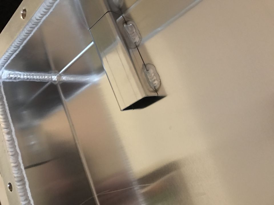 Custom aluminum fabrication with welds and angled port