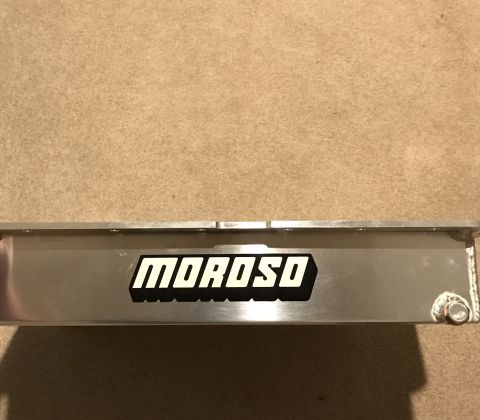 1995 Ford Bronco - A close-up of a silver oil pan with the black and white "MOROSO" logo is visible. The oil pan appears to be part of a vehicle modification.
