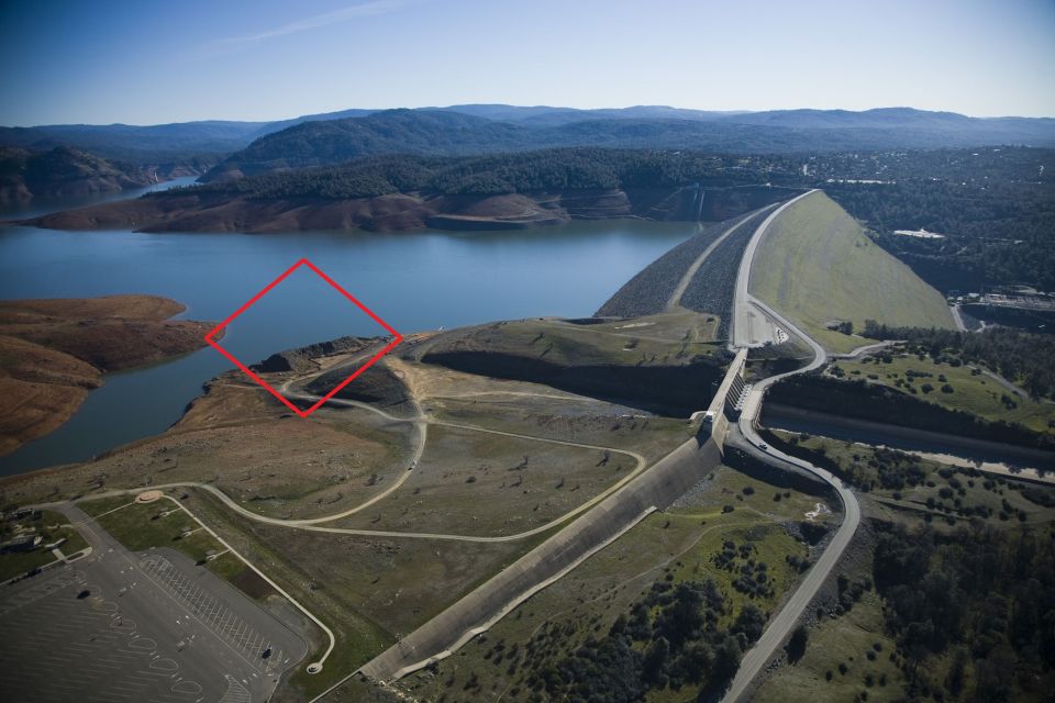 Aerial view of a dam and reservoir.