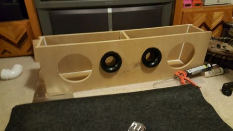 1996 Ford Bronco - Custom speaker box construction in progress, showing the unassembled wooden enclosure.