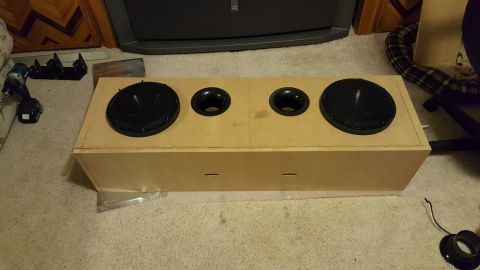 1996 Ford Bronco - A custom-built subwoofer enclosure with two woofers and two ports is shown on a carpeted floor.