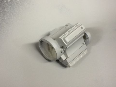 1989 Ford Bronco - A single gray engine part is shown against a white background.