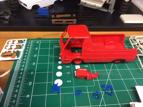 1989 Ford Bronco - Model truck kit parts laid out on a green cutting mat, ready for assembly.