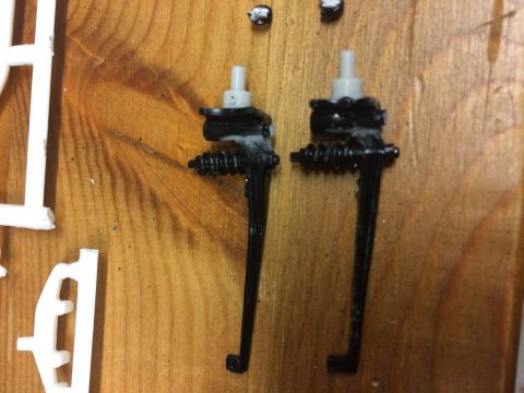 1989 Ford Bronco - Model car parts are shown on a wooden surface, with other unpainted plastic pieces visible.