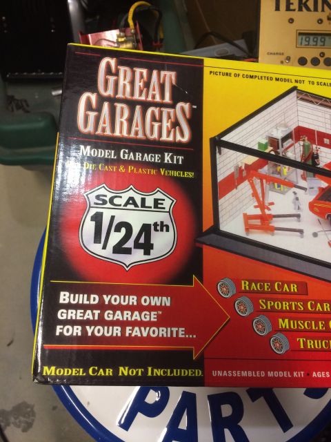 1989 Ford Bronco - A box for a "Great Garages" 1:24 scale model garage kit is shown. The box features a picture of a completed model garage with a car lift an…