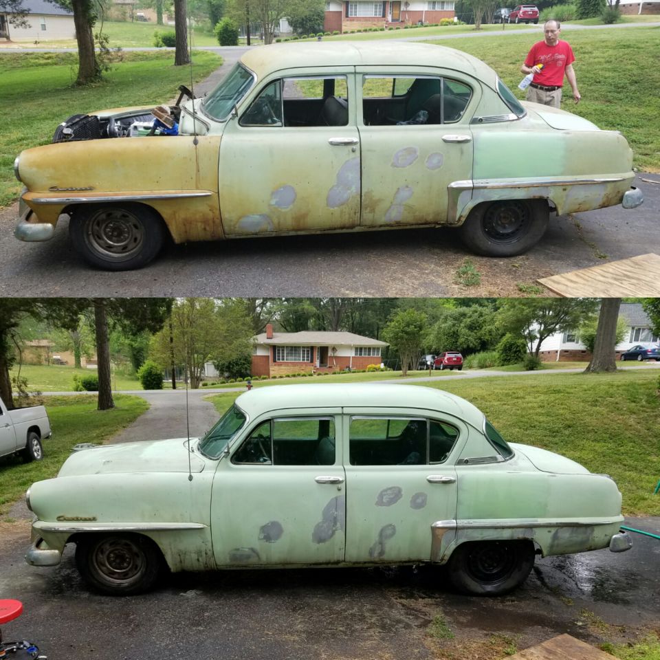 Side view of a 1953 Plymouth Belvedere sedan undergoing restoration, showing primer patches and a new coat of light green paint.
