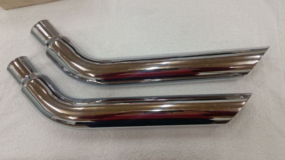 Two chrome exhaust tips with angled ends