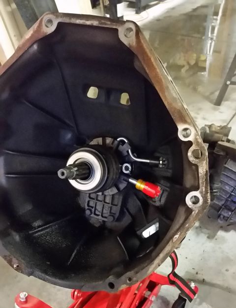 1995 Ford Bronco - What is depicted here is the new slave cylinder placed in the bellhousing of the transmission. Notice that the old slave cylinder leaked fl…