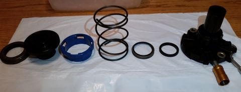 1995 Ford Bronco - Depicted are the constituent parts of the clutch slave cylinder. I'm not sure about the proper terminology for the parts, but from left to…