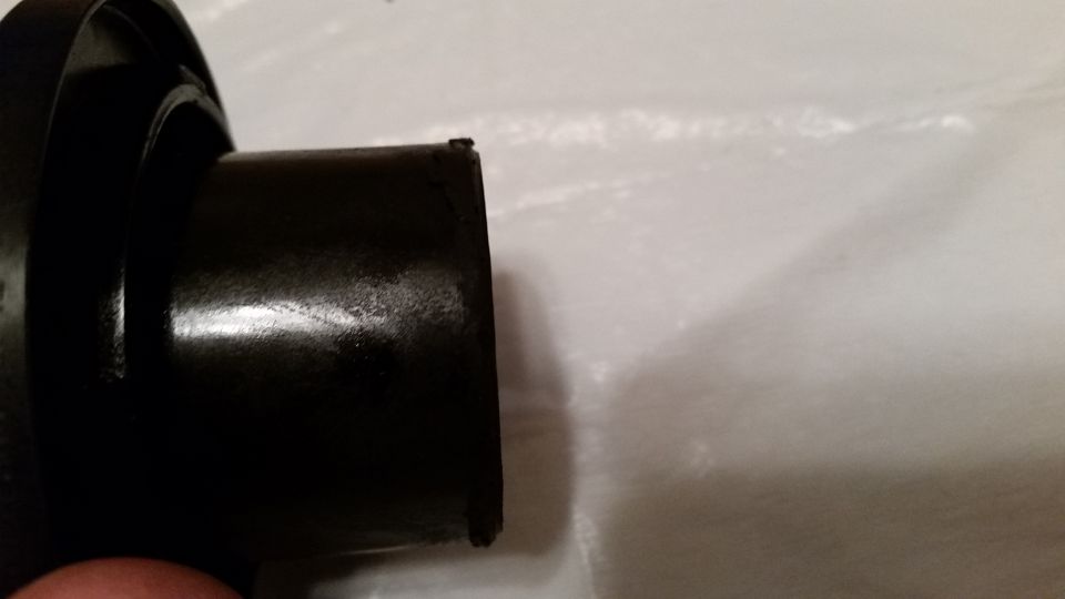 One of the burrs can be plainly seen in the upper "corner" of the piece.  Lack of proper surface preparation and poor quality control at the factory.  These burrs have caused gouges in the seal, which is in the next image.