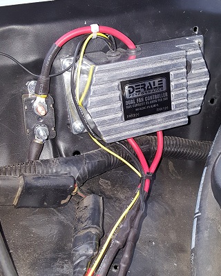 1978 Ford Bronco - Close-up of a Derale Performance Dual Fan Controller, part of a vehicle's cooling system.