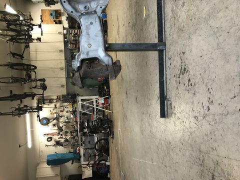 1996 Ford Bronco - Garage scene with vehicle parts and bicycles hanging from the ceiling.