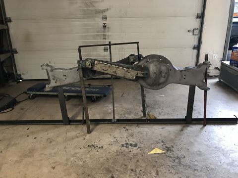 1996 Ford Bronco - This assembly of cut and turned beams is mounted on stands in a garage setting.