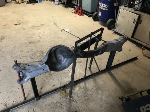1996 Ford Bronco - A vehicle's axle assembly is secured on a fabrication stand, likely for modification or repair.