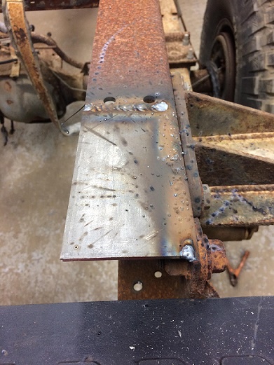 1993 Ford Bronco - Close-up of a welded section on a rusty vehicle frame, indicating repair or modification work.