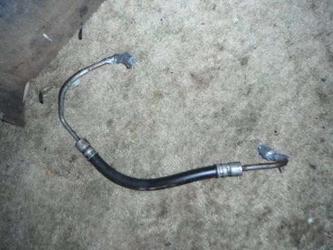 1990 Ford Bronco - This is a power steering hose, likely for a Ford vehicle, as indicated by the Supermotors.net watermark.
