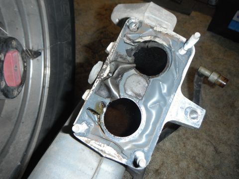 1995 Ford F-150 - A close-up view of a used engine intake manifold, revealing its internal structure and condition.