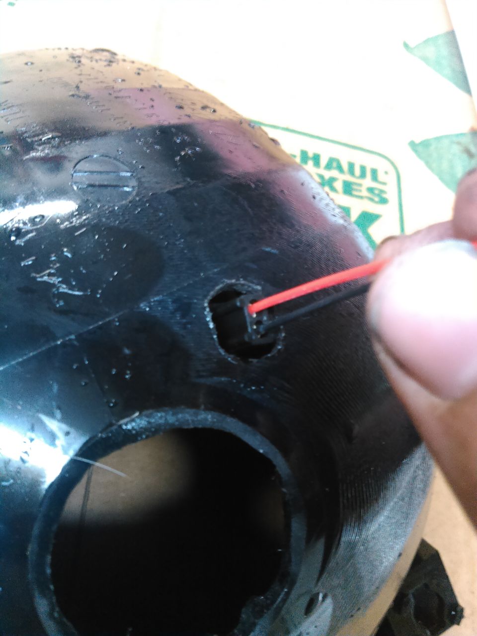 the projector has a 2 wire plug for high beam. jsut need to drill a hole big enough for the plug to fit through. if desired youy can disassemble the plug and small smaller hole for the wires to fit through and then reassemble it.

the projector has a electric solenoid operated blinder that covers a section of the proejector. when high beam is active, the solenoid moves the blinder out of the way allowing more light up higher