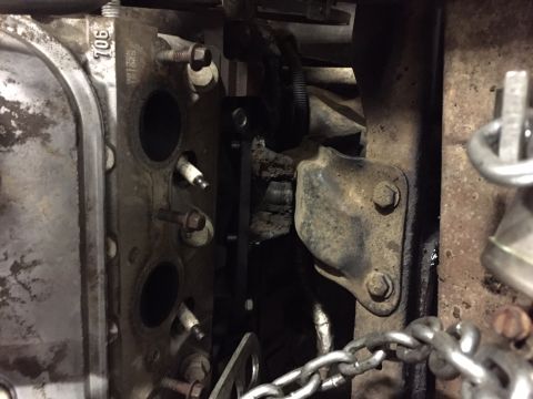 1984 Ford Bronco - This is a close-up view of a V8 engine's cylinder head with spark plugs installed. The engine appears to be dirty and possibly undergoing m…