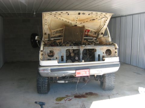 1989 Ford Bronco - She's in...plenty of room. Had to air down the tires and take off my lightbar and modify the garage doors there, but she got in...