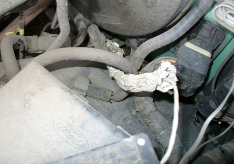 1992 Ford Bronco - Close-up of the cat cable leaving the mystery box.