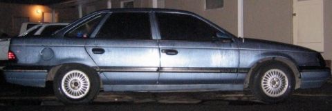 1986 Ford Taurus - This 1986 Ford Taurus is seen from the side in a blue finish.