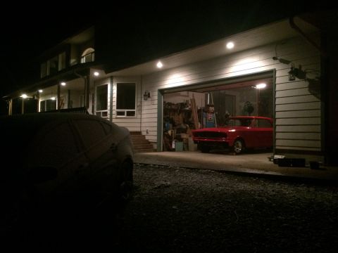1964 Ford Fairlane - A red 1964 Ford Fairlane station wagon is parked inside a garage at night.