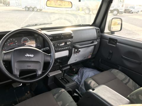 1968 Ford Mustang - Photograph of a Jeep Wrangler interior and dashboard, not a technical document.