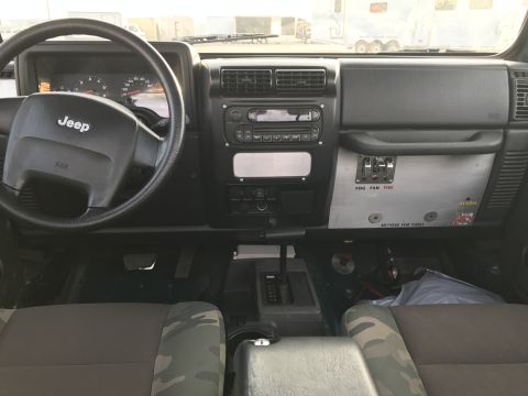 1968 Ford Mustang - Photograph of a Jeep Wrangler interior with a custom switch panel, not a technical document.
