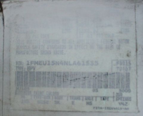 1992 Ford Bronco - Painted over door sticker, more or less legible.