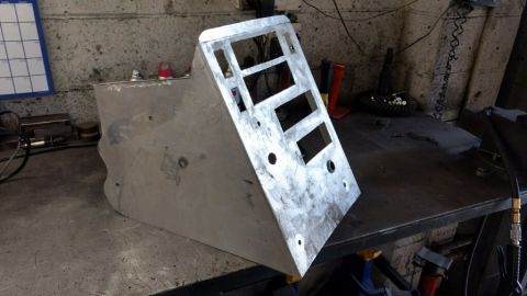 1990 Ford Bronco - Photo of a fabricated aluminum console panel on a workbench, not a technical document.