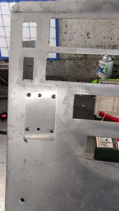 1990 Ford Bronco - Photo of a fabricated aluminum dash panel with drilled mounting holes, not a technical document.