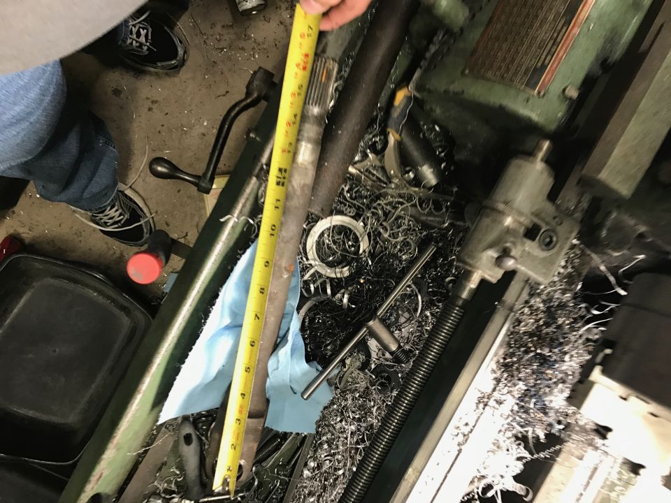 Engine bay with some parts removed, yellow strap visible