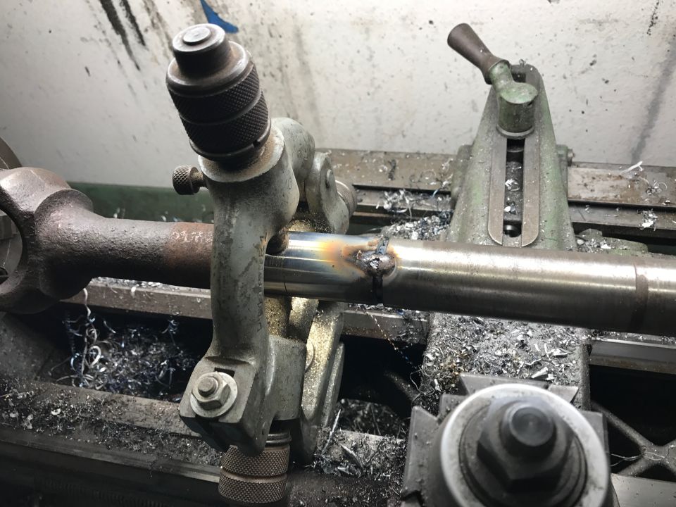 Close-up of suspension components, likely part of a cut and turned beam setup