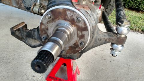 1992 Ford Bronco - This image shows the front wheel hub and suspension components of a vehicle, likely undergoing maintenance or repair.