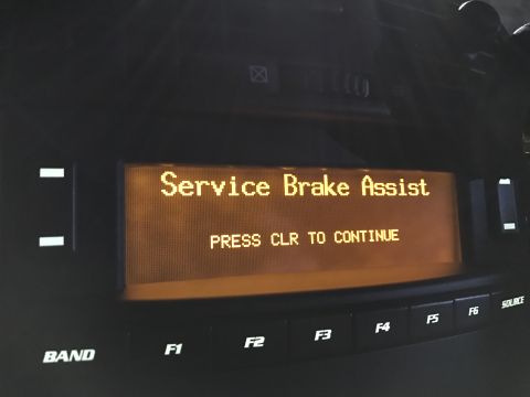 2007 Cadillac CTS - A car's dashboard displays a "Service Brake Assist" warning message.