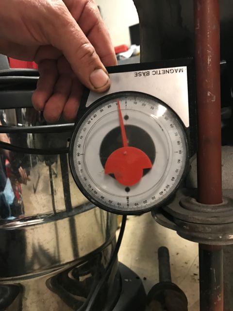 1996 Ford Bronco - A magnetic base inclinometer is used to measure the angle of a metal rod.