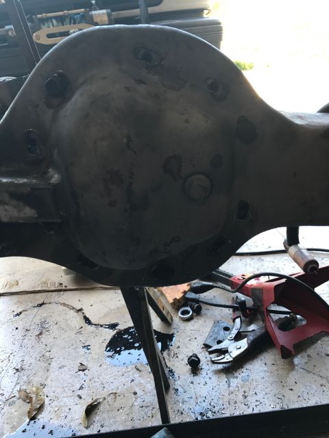1996 Ford Bronco - Close-up of a vehicle's differential housing, possibly undergoing maintenance or repair.