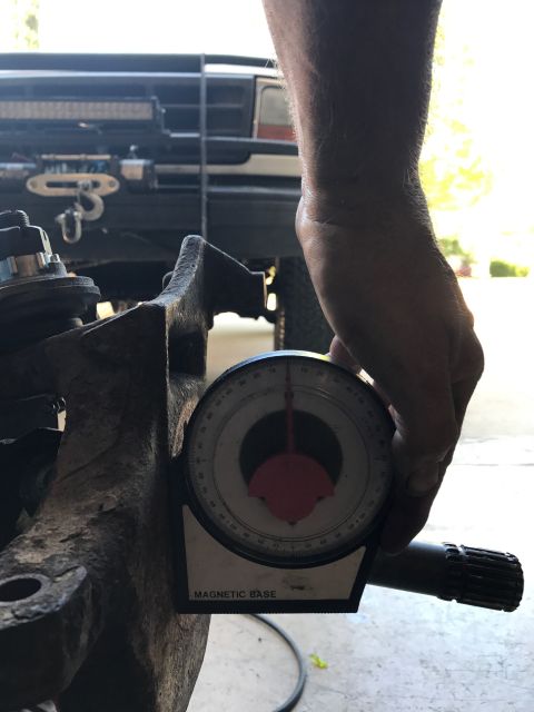1996 Ford Bronco - A magnetic base protractor is used to measure an angle on a vehicle's suspension component.