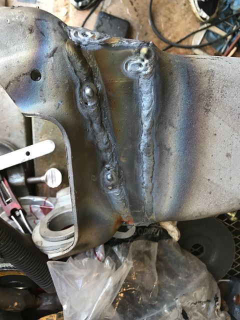 1996 Ford Bronco - This is a close-up view of a welded metal part, likely a component from a vehicle's suspension or frame.