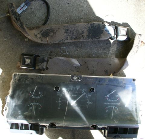 1992 Ford Bronco - Old seat belt stocks and gauge cluster.