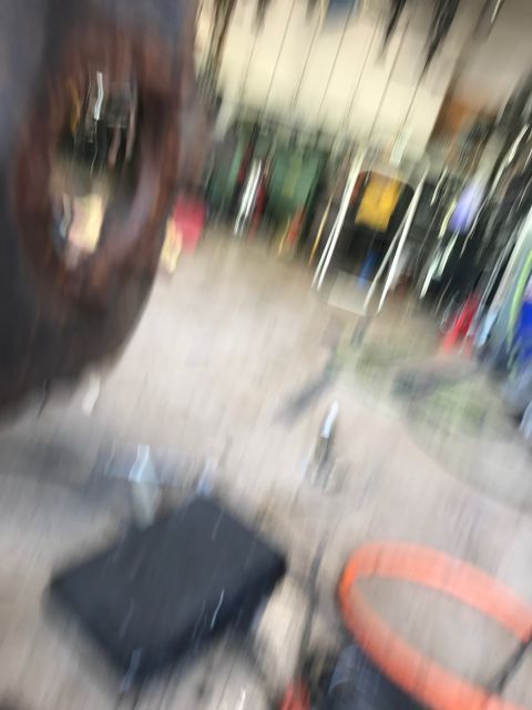 1996 Ford Bronco - A blurry image shows a dark, square object on the floor of what appears to be a garage or workshop. An orange loop is visible to the right…