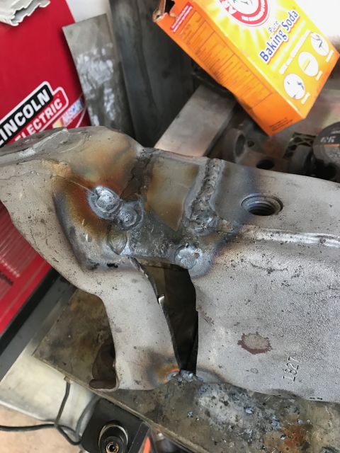 1996 Ford Bronco - A close-up view shows a metal part that has been welded and cut. A box of Arm & Hammer Baking Soda and a red Lincoln Electric box are visib…