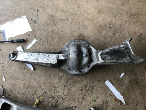 1996 Ford Bronco - A heavily modified differential housing is shown on a concrete surface, likely during a restoration or custom build process. The part appea…