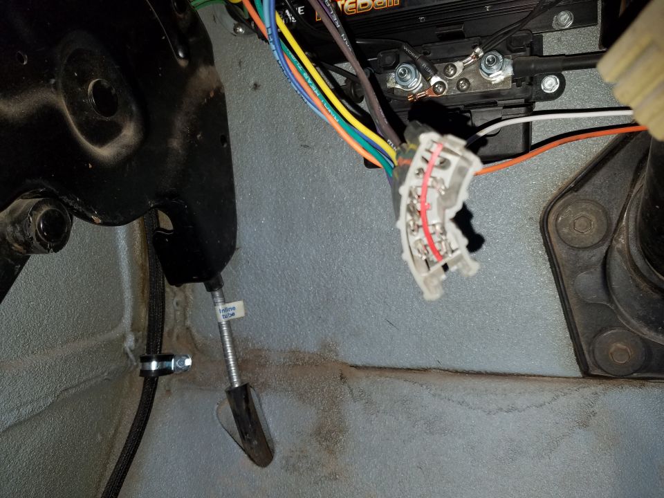 Vehicle interior wiring harness and brake pedal assembly with "inline tube" label.